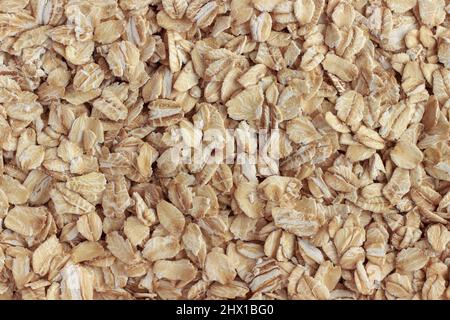Haferflocken (Haferflocken) aus der Nähe. Natürliche und gesunde Lebensmittel. Hintergrund oder Textur. Stockfoto
