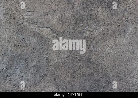 Textur einer Betonoberfläche auf der Basis von Sand und Zement mit einem Riss. Abstrakter Hintergrund, nahtlose Textur. Stockfoto