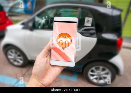 Smartphone und Sharing Car Stockfoto
