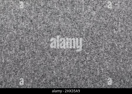 Hellgraue Melange-Strickware aus Heidekraut-Mischgarn mit strukturiertem Hintergrund Stockfoto