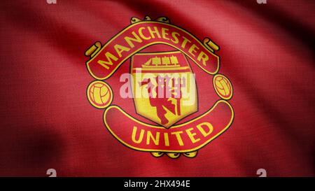 Winkende Flagge des FC Manchester United. Nahaufnahme der winkenden Flagge mit dem Fußballverein-Logo von Manchester United, nahtlose Schleife. Redaktionelles Filmmaterial. Stockfoto