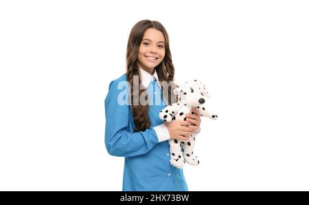 Vet zukünftige Karriere. Glückliches Kind mit lockigen Haaren halten Spielzeug. Glückliche Kindheit. Spielen mit Hund Spielzeug. Stockfoto