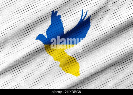 Taube Form in Ukraina Flagge Farben auf Jersey Kleidung Stoff Textur Hintergrund Stockfoto