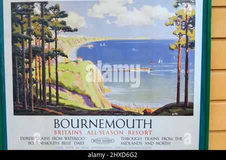 England, Dorset, Isle of Purbeck, Corfe Castle, The Historic Railway Station, Vintage Railway Poster Advertising Service to Bournemouth Stockfoto