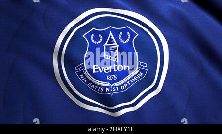 Flugflagge mit Everton FC Fußballverein-Logo, Nahaufnahme. Bewegung. Winkende abstrakte blau-weiße Flagge mit dem Emblem eines englischen Profis Stockfoto