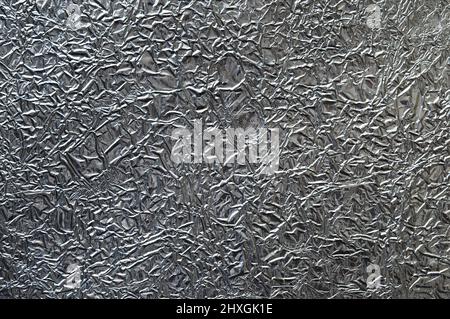 Zerknittert Aluminiumfolie Hintergrund. Stockfoto