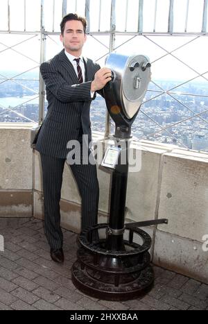 Matt Bomer aus der USA Network-Serie 'White Collar' besucht das Empire State Building in New York, USA. Stockfoto