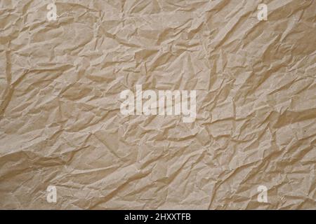 Detailreiche, zerknitterte Papiertextur. Abstrakter Hintergrund für Design. Stockfoto