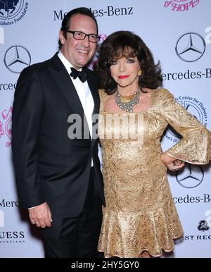 Joan Collins und Percy Gibson kommen zum Carousel of Hope Ball im Beverly Hilton Hotel, Los Angeles. Stockfoto