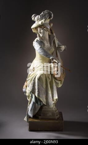 Frau spielt eine „Viola da Gamba“. Albert-Ernest Carrier-Belleuse (Frankreich, Aisne, Anizy-le-Château, 1824-1887)Hippolyte Boulenger faiencerie (Frankreich, Choisy-le-ROI). Circa 1880-1897. Skulptur. Glasierte Keramik mit Holz-und-Rosshaar Bogen Stockfoto