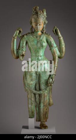 Die androgyne Form von Shiva und Parvati (Ardhanarishvara). Nepal, um 1000. Skulptur. Unlegiertes Kupfer mit Granaten und Smaragd intariert; Spuren von Farbe Stockfoto