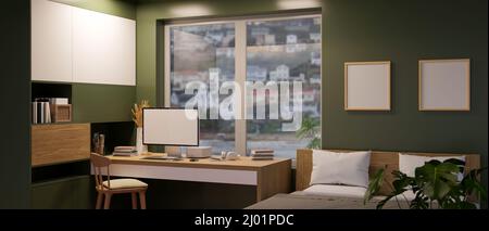 Modernes Luxus-Apartment-Schlafzimmer mit eingebauten Regalen, komfortablem Bett und Computerschreibtisch in der modernen grünen Wand. Stockfoto