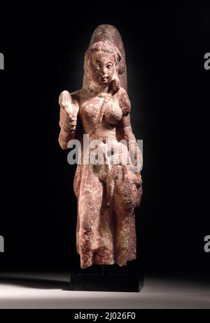 Die androgyne Form von Shiva und Parvati (Ardhanarishvara). Indien, Uttar Pradesh, Mathura, 2.-3. Jahrhundert. Skulptur. Melierter roter Sandstein Stockfoto