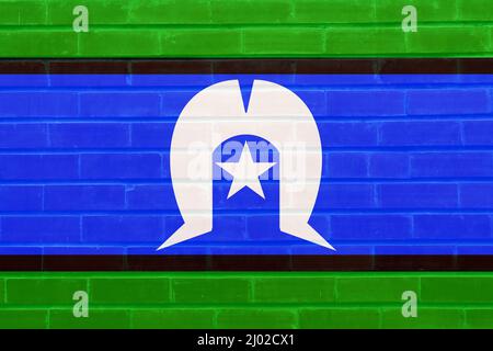 Die Flagge des australischen Torres Strait Islanders malte auf einer Ziegelwand Stockfoto