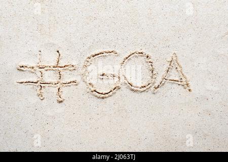 Handschriftliche Worte 'Goa' auf Sand am Strand Stockfoto