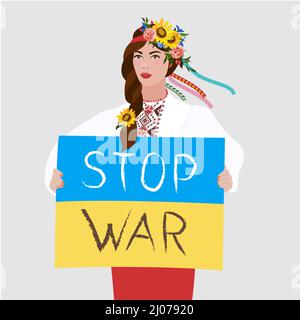 Brünette Frau mit typisch ukrainischem Outfit und Blumenkrone auf ihrem Kopf mit einem Zeichen mit Nation Stockfoto