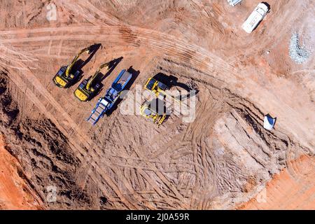 Schwere Traktor Maschinen Bagger richten Sie die Erde tun Landschaftsbau Stockfoto