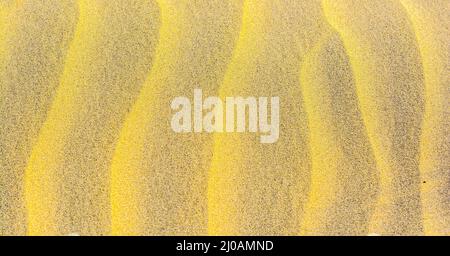 Textur oder Muster aus geriffeltem Sand Stockfoto