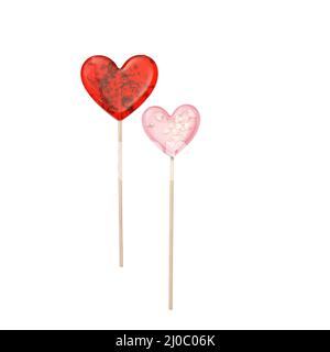 Roter herzförmiger Lollipop mit Kräutern und rosa Stern Lollipop innen auf einem Stock isoliert auf weiß. Geschenk zum Valentinstag. Quadratisches Format Stockfoto