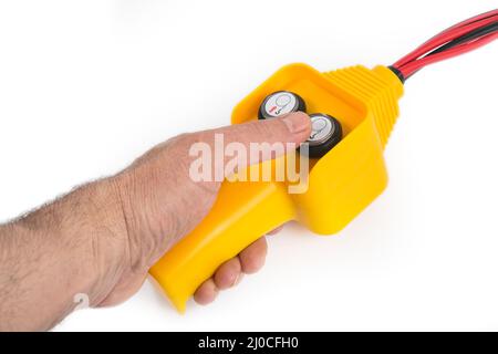 Fernbedienung in einer Hand Stockfoto