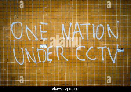 Eine Nation unter CCTV Graffiti Stockfoto