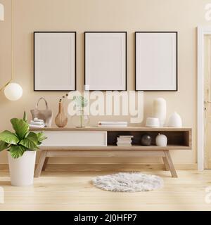 Poster mit schwarzem Rahmen auf Schrank in hellem Raum mit Pflanzen auf cremefarbenem Wandhintergrund.3D Rendering Stockfoto