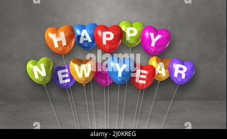 Bunte fröhliche neue Jahr Herz-Form Ballons auf einem grauen Beton Hintergrund. Horizontales Banner Stockfoto