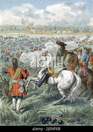 Passage du Rhin par Louis XIV , le 16 juin 1672 : Le 6 avril 1672, Louis XIV déclare la guerre aux Provinces-Unies (Pays-Bas du Nord) pour affaiblir la republique protestante qui menace la puissance economique et commerciale Francaise - A la tete de l’armee, Louis de Bourbon-Conde (1621-1686), Cousin du roi, atteint un bras du Rhin a proximite de Schenk, en face du Village de Tolhuys - Le fleuve est a son etiage, ce qui le rend Franchissable a gue - Les troupes du Prince Guillaume d’Orange (1650-1702) n’opposent que peu de resistance aux 20 000 soldats francais qui traversent le fleuve sans p Stockfoto