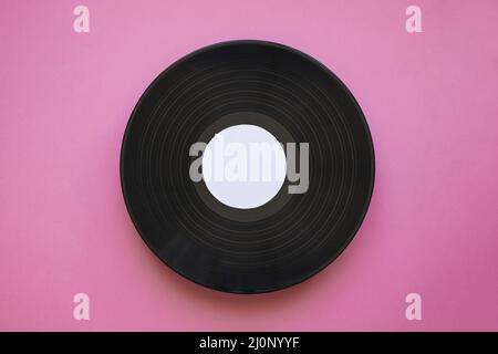 Vinyl-Mockup rosa Hintergrund. Hohe Qualität und Auflösung schönes Fotokonzept Stockfoto