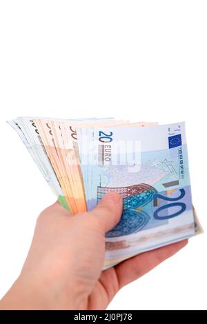Ein Mann hält einen Euro in der Hand auf einem weißen Hintergrund aus der Nähe Stockfoto