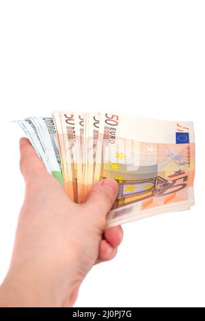 Ein Mann hält einen Euro in der Hand auf einem weißen Hintergrund aus der Nähe Stockfoto