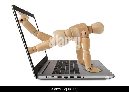 Mann, der aus dem Bildschirm „Computer Notebook“ kriecht Stockfoto
