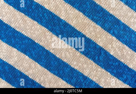 Hintergrund der handgefertigten Strickstoff aus Baumwolle blau und weiß Farbe, Stoff gestrickt gestreifte Textur. Stockfoto