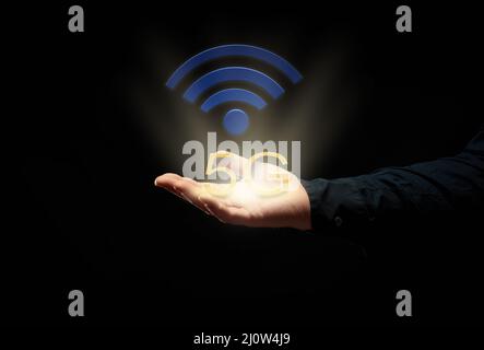 Männliche Hand auf schwarzem Hintergrund und Hochgeschwindigkeits-Internet-Symbol 5. Einführung neuer moderner Technologien Stockfoto