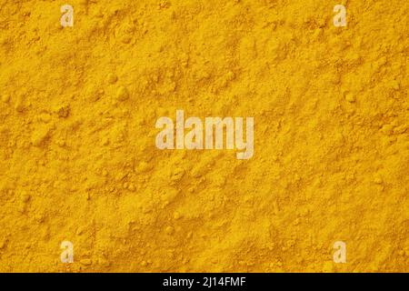 Kurkuma Gewürz Hintergrund. Curcuma-Pulver würzende Textur. Stockfoto