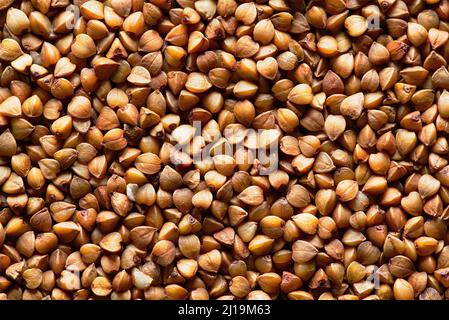Abstrakter Buchweizen-Hintergrund. Frischer Buchweizen. Trockener Buchweizen-Hintergrund. Textur Stockfoto