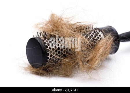 Metall runde Haarbürste und Haarklumpen Stockfoto