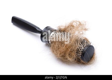 Metall runde Haarbürste und Haarklumpen Stockfoto