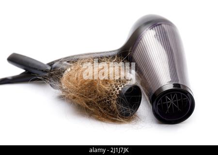Haartrockner und Bürste mit einem Haarklumpen Stockfoto