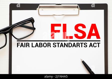 Geschäftsfoto zeigt gedruckten Text FLSA Fair Labor Standards Act Stockfoto