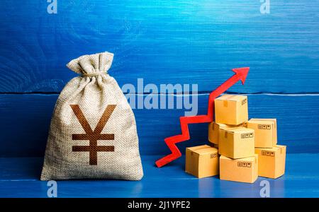 Chinesische Yuan oder japanische Yen Geldbeutel mit Kisten und Pfeil nach oben. Gute Verbraucherstimmung und Nachfrage nach Waren. Hohe Umsätze. Produktionsanstieg. Einkommen Erw Stockfoto