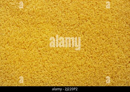 Eine Textur aus gelbem Waschküchenschwamm Stockfoto