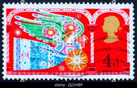 GROSSBRITANNIEN - UM 1969: Eine in Großbritannien gedruckte Briefmarke zeigt Angel, Weihnachten, um 1969 Stockfoto