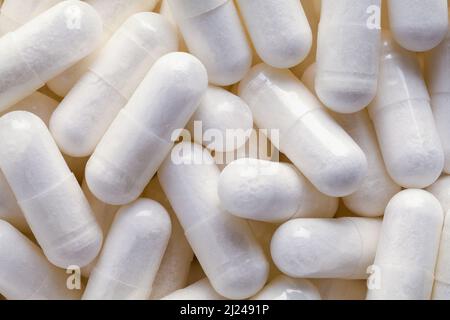 Stapel von verschreibungspflichtigen Medizin Capsule Pills Hintergrund Nahaufnahme. Stockfoto