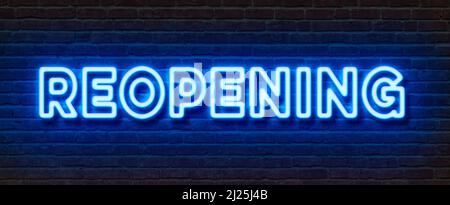 Neonschild an einer Ziegelmauer - Wiedereröffnung Stockfoto