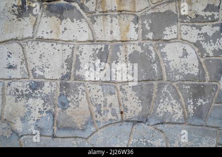 Strukturkarte. Betonwand im Stein-Look mit abblätternder Farbe. Speicherplatz Kopieren. Hintergrund. Stockfoto