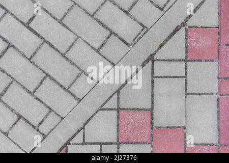 Grau Bürgersteig Fliesen Straße Stein Stadt Straße abstrakt städtisch Muster Farbe rot oder rosa Design Textur Pflaster Hintergrund. Stockfoto