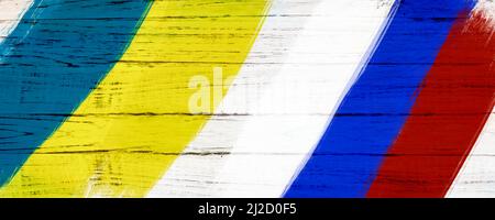 Das Konzept der ukrainischen Flagge auf einem weißen Holzhintergrund. Stockfoto