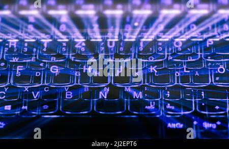 Zoom-Effekt einer beleuchteten Laptop-Tastatur, Zoom-Effekt einer beleuchteten Laptop-Tastatur Stockfoto