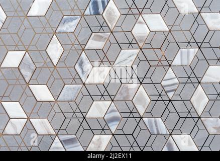 Graue Keramikfliesen mit geometrischem Muster. Fliesen mit 3D Quadraten. Stockfoto